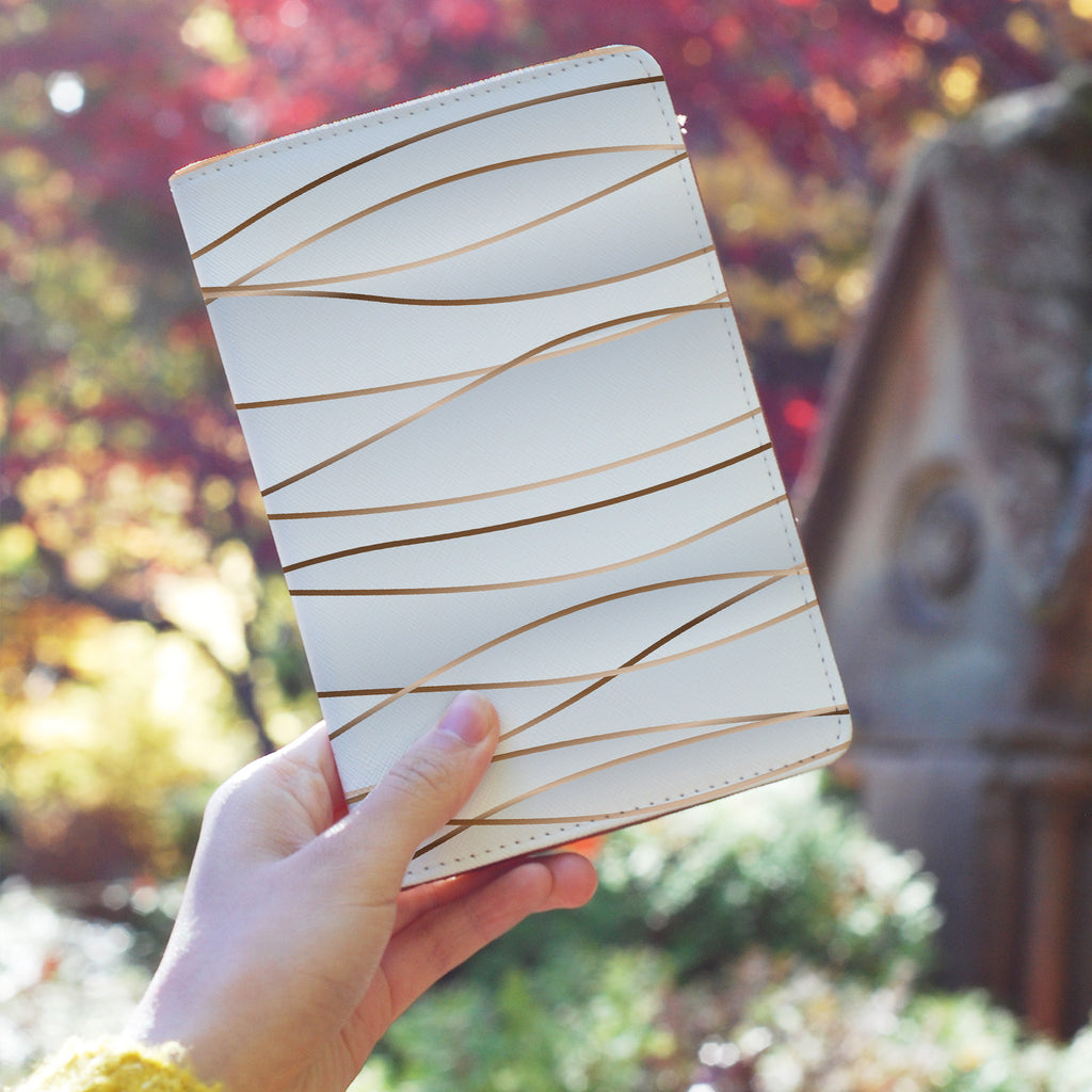 a girl holding personalized RFID blocking passport travel wallet with Luxury design