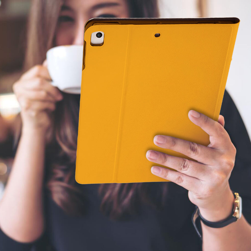 a girl is holding and viewing personalized iPad folio case with Cat Fun design