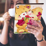 a girl is holding and viewing personalized iPad folio case with Bear design