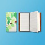 the front top view of midori style traveler's notebook with Leaves design